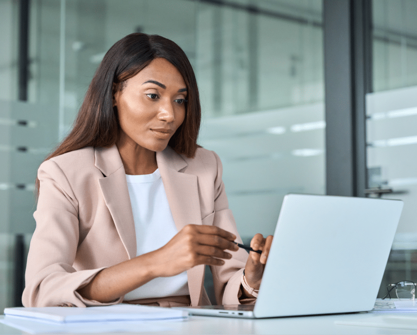 Woman working on laptop in business office