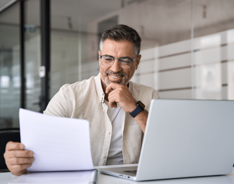 Man reading transactional print and mail document